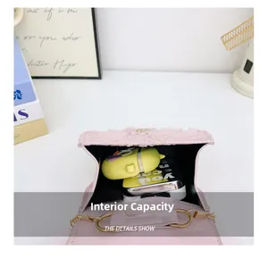 Detail showing internal capacity of girls pink lace mini bag with gold chain strap