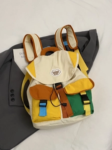 Vibrant color-block canvas backpack with drawstring and buckles for daily student use