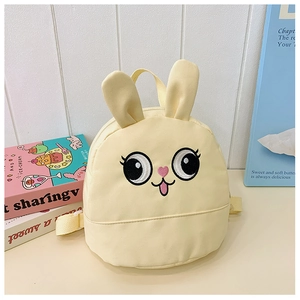 Detail of cute yellow bunny backpack for kids with 3D ears and cartoon embroidery design