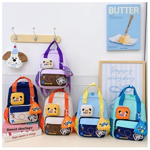 Detail showing various colors of cute panda backpacks with small aircraft charms