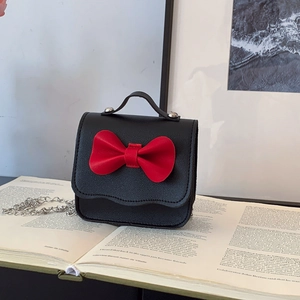 Cute mini girl's crossbody bag with red leather bow and silver metal chain strap