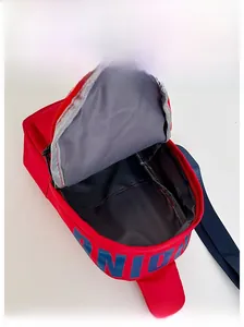 Internal view of red nylon chest bag with blue UNION logo and gray lining space