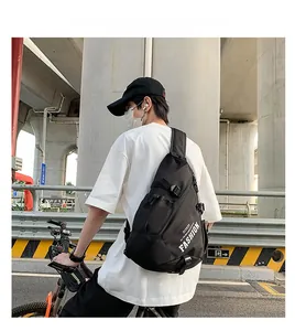 Detail of multi-functional black chest bag with FASHION lettering and zipper pockets
