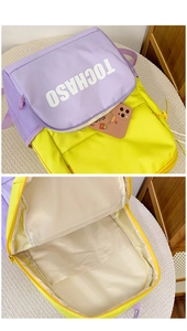 Close-up of dual-tone purple backpack featuring spacious interior and mesh side pocket