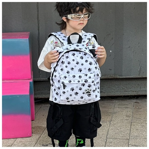 Toddler backpack featuring all-over black paw prints and durable adjustable straps
