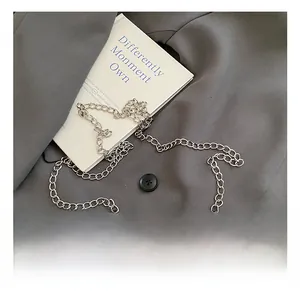 Detailed view of polished silver metal chain strap for girls fashion handbag