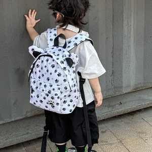 Cute white kids backpack with black paw prints and decorative ears for kindergarten school