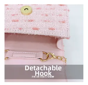 Detail of pink tweed bag featuring gold magnetic clasp and detachable metal chain hook