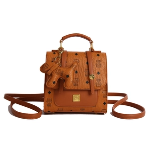 Brown monogram backpack with cat charm and stylish diamond pattern for women