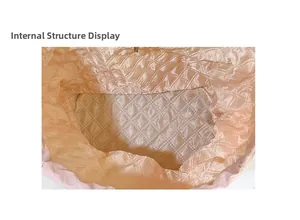 Internal structure of the plaid nylon backpack showing the spacious pink quilted lining