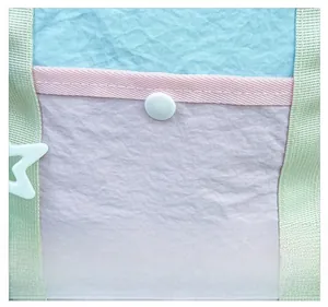 Close-up of contrast color stitching and star charm on the lightweight kids backpack