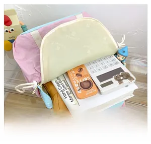 Detail of spacious interior storage for school supplies in pink and blue contrast backpack