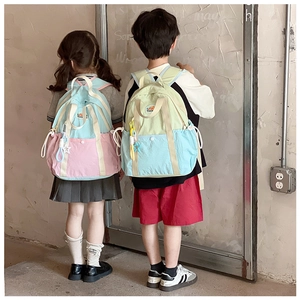 Kids color-block lightweight canvas backpacks in pastel pink and blue on children