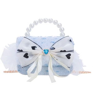 Blue tweed girls handbag with pearl handle and heart bow detail on white background