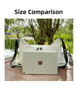 Detailed comparison of the off-white crescent crossbody bag next to an iPad for size reference