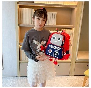 Detail of red robotic school backpack for kids with a panda logo and side stripes