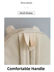 Detail view of the thickened carry handle on the cream Capybara cartoon kids backpack
