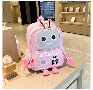 Detailed view of pink robot backpack with panda motif on wooden display stand