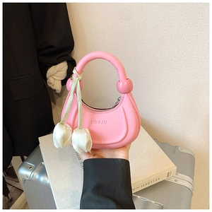 Pink crescent hobo bag for kids featuring silk scarf and tulip charm accessory