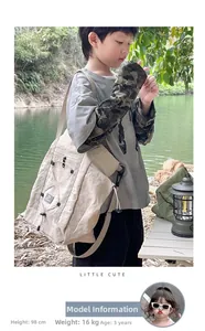 Detail of khaki nylon kids crossbody bag showing material texture on 98cm tall child