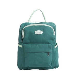 Cute candy-colored waterproof nylon backpack for kids with a stylish green patchwork design