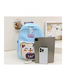Size comparison of a light blue cartoon school backpack with phone and tablet