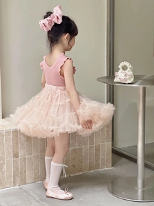 Side view of pink princess tutu outfit with ruffled top and fluffy tulle skirt for girls