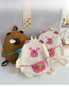 Detailed close-up of cute cartoon Capybara backpacks with creative turtle doll charms