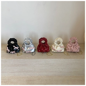 Collection of mini ruched purses with pink bows and chain straps in five colors