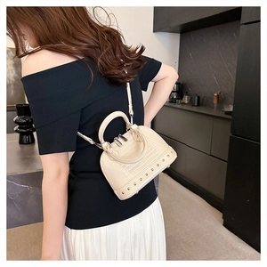 Chic beige crocodile texture mini shell bag with metal rivet details and a crossbody strap