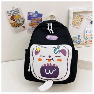 Detail of cute purple bear print and white pocket on black canvas school backpack