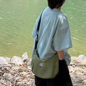 Olive green nylon half-moon crossbody bag for kids with adjustable shoulder strap