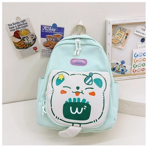 Detail of mint green school bag with cartoon bear pocket and DOUDING brand label