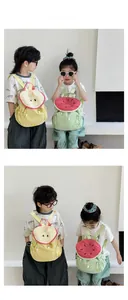 Detail of vibrant Apple and Watermelon themed kids backpacks with creative embroidery
