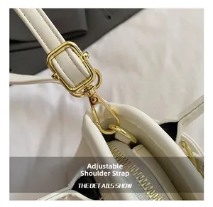 Detail of adjustable golden strap buckles and fine leather texture on kids seashell bag