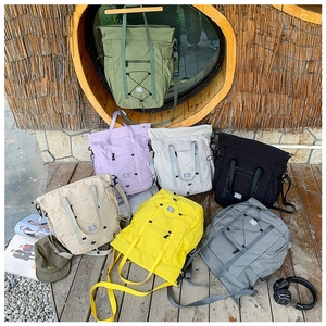 Detailed arrangement of multi-colored large-capacity kids travel bags in outdoor setting