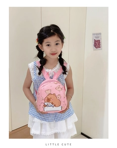 Detailed view of pink toddler backpack featuring a cute cartoon bear print design