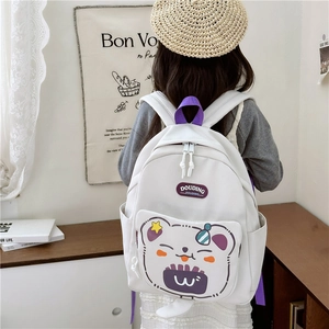 Lightweight white and purple kids cartoon backpack with cute animal print shown on model