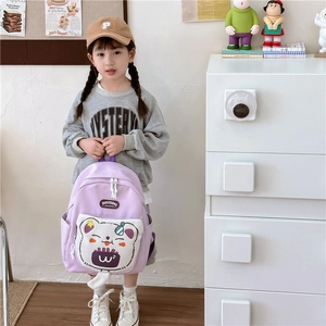 Light purple large capacity kids school bag with cute cartoon bear pattern and soft straps