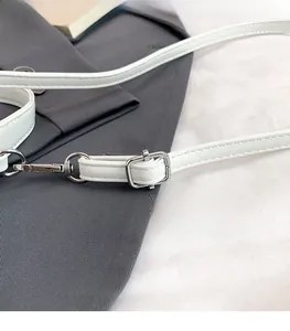 Detail of adjustable white leather strap with silver buckle and lobster clasp