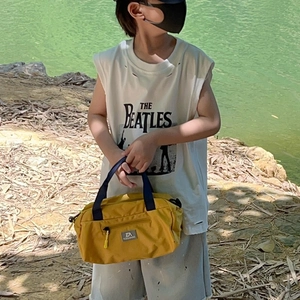 Kids yellow nylon duffle bag with black strap for outdoor travel and sports