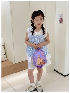 Detail of a light purple toddler backpack with cute cartoon bear and bread print patterns