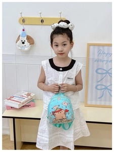 Light blue mini backpack with cartoon print for toddlers featuring adjustable straps