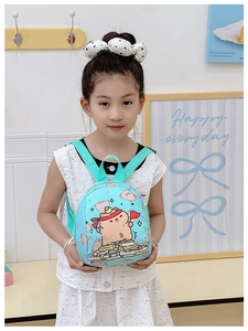 Toddler backpack featuring Capybara print and adjustable mint green straps shown on model