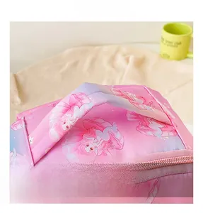 Detail of comfortable padded handle and smooth metal zippers on cartoon mermaid bag