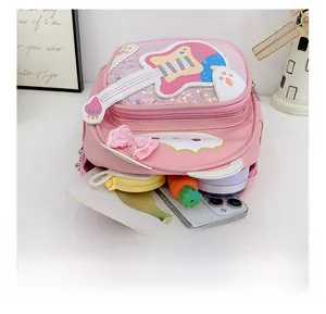 Detail view of pink sequin toddler backpack interior showing daily storage capacity