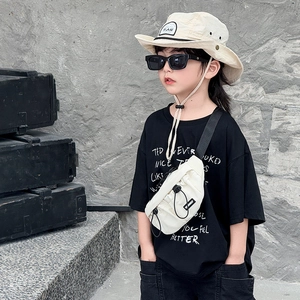 White canvas crossbody chest bag for kids with black drawstring and adjustable strap