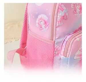 Close-up of pink mermaid schoolbag featuring elastic mesh side pocket for water bottles