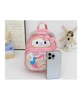 Pink cartoon backpack size comparison with a smartphone showing dimensions and detail