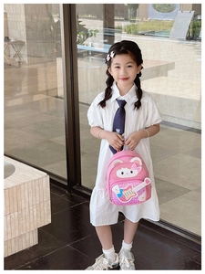 Close-up of pink toddler backpack featuring sequined cartoon cat with colorful guitar detail